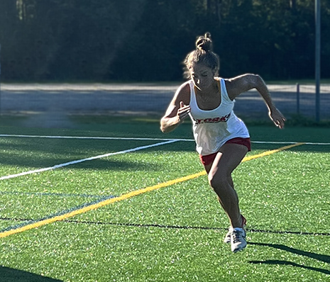 Teenage girl running Tork sports performance